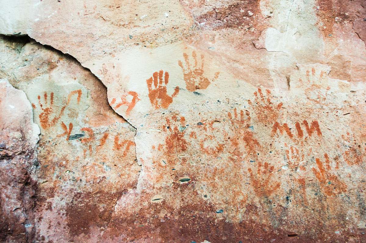 wetmore landing hand prints on gray concrete wall marquette